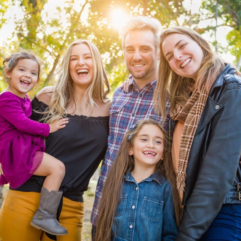 Mixed Race Family Members Having Fun Outdoors.
